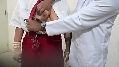 Indian doctor using schoolgirl in clinic