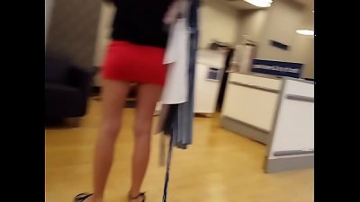 Candid ash-blonde tight miniskirt shopping